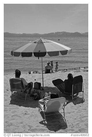 Beach unbrella and family, Sand Harbor, Lake Tahoe-Nevada State Park, Nevada. USA (black and white)