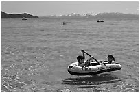 Children playing in inflatable boat, Sand Harbor, Lake Tahoe-Nevada State Park, Nevada. USA (black and white)