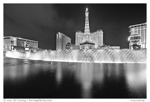 Bellagio dancing fountains and hotels reflected in lake. Las Vegas, Nevada, USA (black and white)