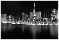Bellagio dancing fountains and casinos reflected in lake. Las Vegas, Nevada, USA (black and white)