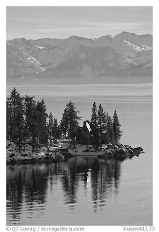 Cabin on lakeshore and snowy mountains, Lake Tahoe, Nevada. USA (black and white)