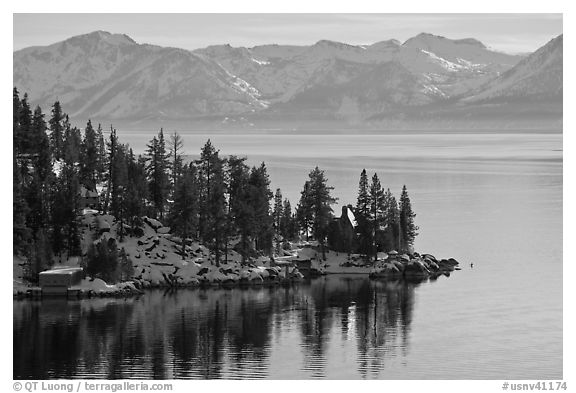 Lakeshore with houses and snow-covered mountains, Lake Tahoe, Nevada. USA (black and white)