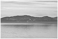 Distant mountains on lake rim in winter, Lake Tahoe, Nevada. USA (black and white)