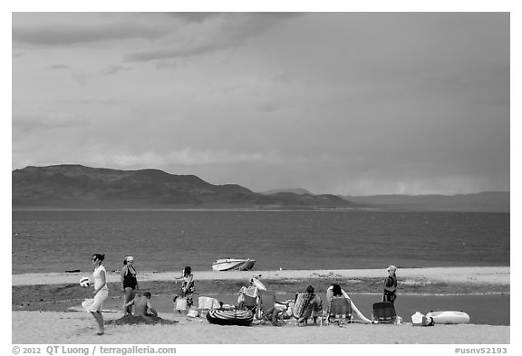 Lakeshore beach recreation, approaching storm. Pyramid Lake, Nevada, USA (black and white)