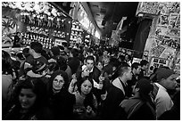 Densely packed crowds in circus arcade. Reno, Nevada, USA (black and white)