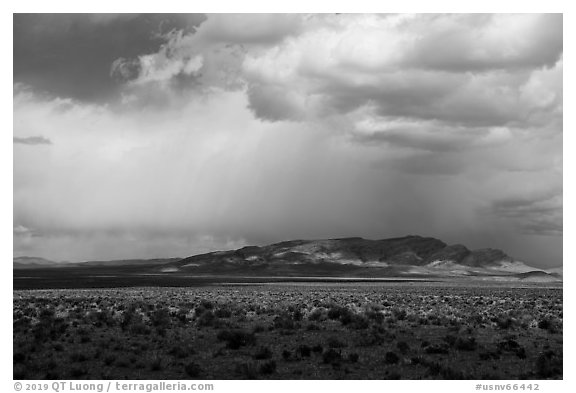 Wide valley, distant mountains, and clouds. Basin And Range National Monument, Nevada, USA (black and white)