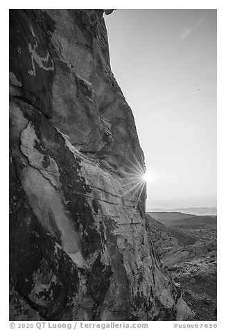 Cliff with Falling Man petroglyph and sun. Gold Butte National Monument, Nevada, USA (black and white)