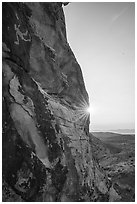 Cliff with Falling Man petroglyph and sun. Gold Butte National Monument, Nevada, USA ( black and white)