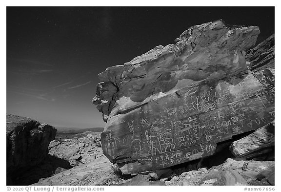 Newspaper Rock with petroglyphs at night with moonlight. Gold Butte National Monument, Nevada, USA (black and white)