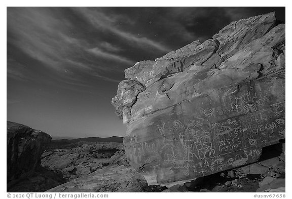 Rock with petroglyphs at night with clouds. Gold Butte National Monument, Nevada, USA (black and white)