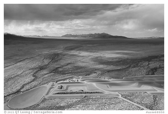 Aerial view of part of Michael Heizer's City with sun. Basin And Range National Monument, Nevada, USA (black and white)