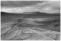 Aerial view of part of Michael Heizer's City with sun. Basin And Range National Monument, Nevada, USA ( black and white)