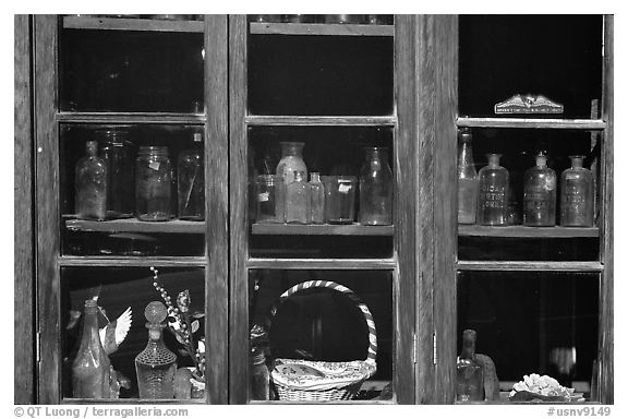 Old bottles in a store window, Austin. Nevada, USA (black and white)