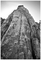 Tall sandstone wall with rock climbers. Red Rock Canyon, Nevada, USA (black and white)