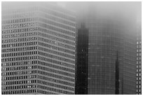 Top of high-rise buildings capped by fog. Houston, Texas, USA ( black and white)