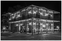 House with wrought iron balconies at night. Jefferson, Texas, USA ( black and white)