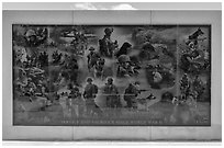 Mural with etched images of action during World War II, the Korean War, the Vietnam War, and Middle East wars, Military Working Dog Teams National Monument. San Antonio, Texas, USA ( black and white)