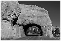 Road tunnel in pink limestone cliff. Utah, USA (black and white)