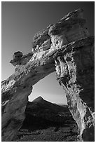 Grosvenor Arch framing peak. Grand Staircase Escalante National Monument, Utah, USA ( black and white)