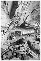 Fireplace and other structures in alcove, Perfect Kiva complex. Bears Ears National Monument, Utah, USA ( black and white)