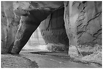 Slide Rock Arch with Paria River flowing through. Paria Canyon Vermilion Cliffs Wilderness, Arizona, USA ( black and white)