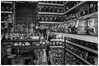 Temple room containing funeral urns with ashes of the deceased. Ho Chi Minh City, Vietnam ( black and white)