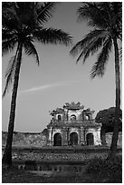 Palm trees and gate, Hue citadel. Hue, Vietnam ( black and white)