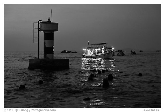 Lighted boat a dusk. Phu Quoc Island, Vietnam (black and white)