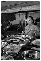 Woman preparing food, Dinh Cau Night Market. Phu Quoc Island, Vietnam (black and white)
