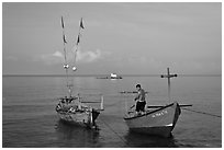Fisherman on skiff. Phu Quoc Island, Vietnam ( black and white)