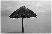 Sun shade in shallow beach water. Phu Quoc Island, Vietnam (black and white)