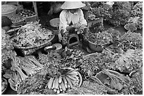 Woman selling vegetables at public market, Duong Dong. Phu Quoc Island, Vietnam ( black and white)