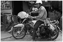 Moterbike rider carrying chickens, Duong Dong. Phu Quoc Island, Vietnam ( black and white)