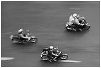Motorbike riders seen from above with speed blur. Ho Chi Minh City, Vietnam ( black and white)