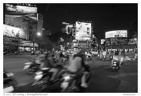 Moving traffic at night on traffic circle. Ho Chi Minh City, Vietnam