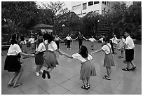 Children playing in circle in park. Ho Chi Minh City, Vietnam ( black and white)