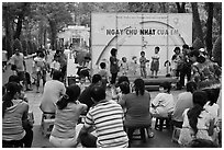 Children singing, Cong Vien Van Hoa Park. Ho Chi Minh City, Vietnam ( black and white)