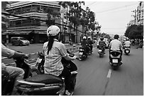 Motorcycle traffic seen from the street. Ho Chi Minh City, Vietnam ( black and white)