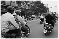 Motorcycle traffic seen from a motorcyle in motion. Ho Chi Minh City, Vietnam ( black and white)