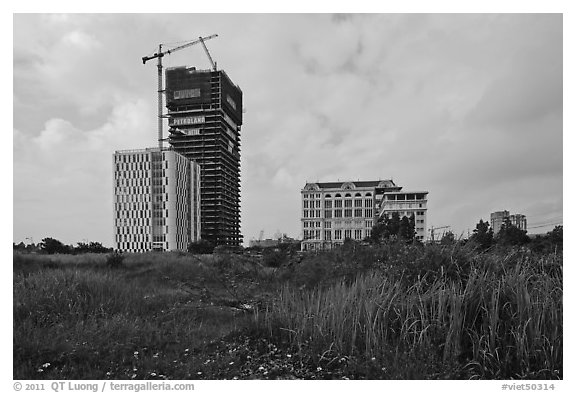 High rise towers in construction on former swampland, Phu My Hung, district 7. Ho Chi Minh City, Vietnam (black and white)
