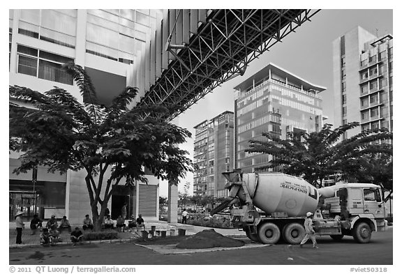 Asphalt truck and new urban area, Phu My Hung, district 7. Ho Chi Minh City, Vietnam (black and white)