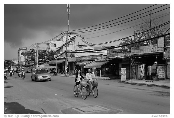 Street with moonson clouds, district 7. Ho Chi Minh City, Vietnam (black and white)