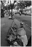 Women selling fruit on a large boulevard. Ho Chi Minh City, Vietnam (black and white)