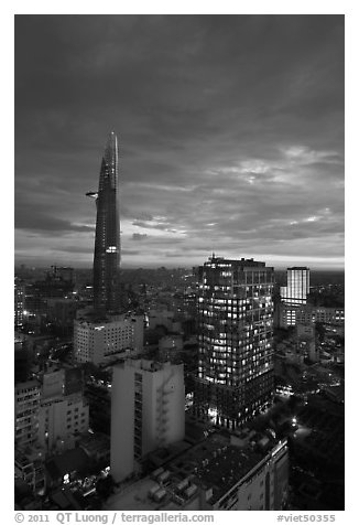 Bitexco Tower and city lights at sunset. Ho Chi Minh City, Vietnam (black and white)