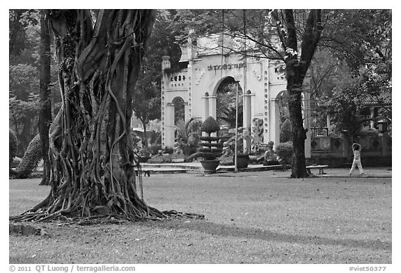 Tree, lawn, and gate, Van Hoa Park. Ho Chi Minh City, Vietnam (black and white)