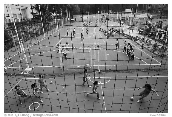 Stadium with girls team athetics, Van Hoa Park. Ho Chi Minh City, Vietnam (black and white)