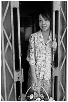 Teacher in doorway, Ho Chi Minh city. Vietnam (black and white)