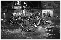 Street flooded by mooson rains at night. Ho Chi Minh City, Vietnam ( black and white)