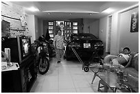 Living room used as car and motorbike garage. Ho Chi Minh City, Vietnam ( black and white)