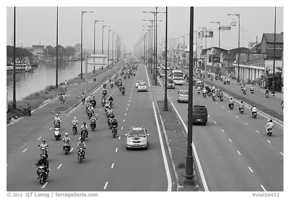 Busy expressway on banks of Saigon Arroyau. Cholon, Ho Chi Minh City, Vietnam (black and white)